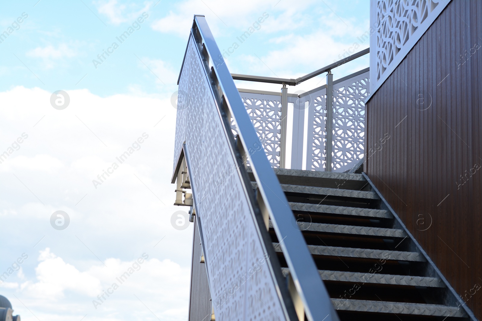 Photo of View of metal outdoor stairs with railing