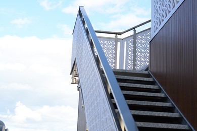 View of metal outdoor stairs with railing