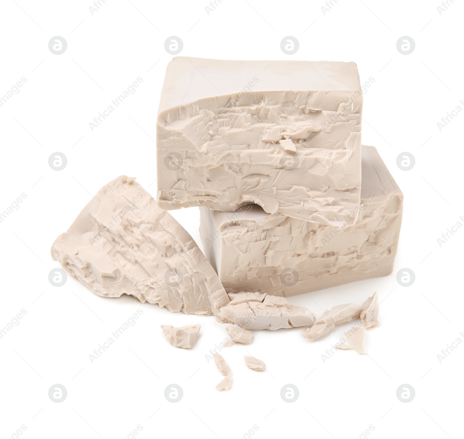 Photo of Blocks of compressed yeast on white background