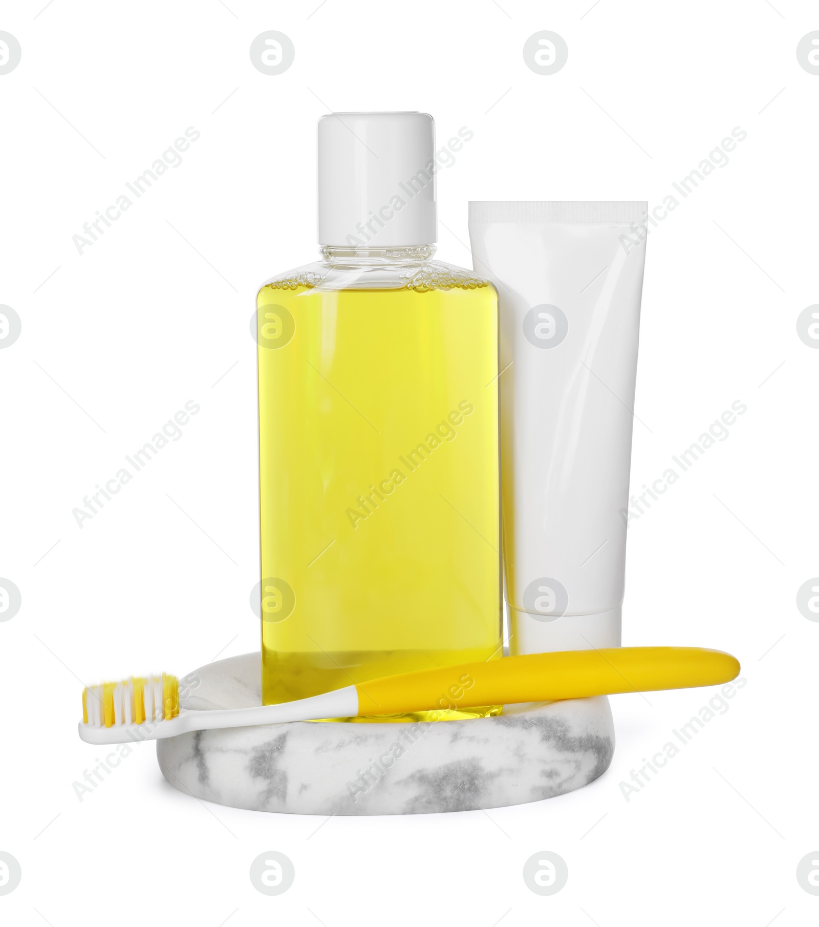 Photo of Mouthwash, toothbrush and toothpaste isolated on white