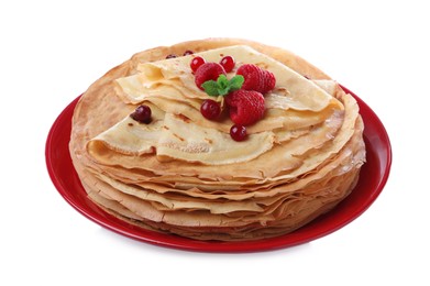 Delicious crepes with berries and mint on white background