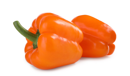 Photo of Ripe orange bell peppers isolated on white