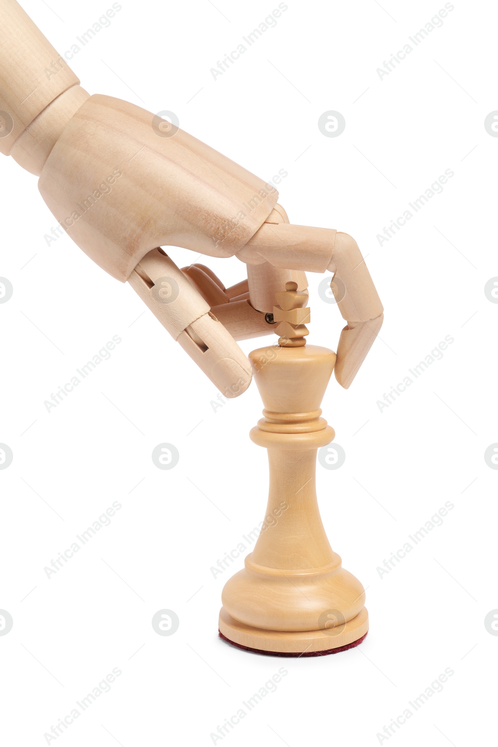 Photo of Robot with chess piece isolated on white. Wooden hand representing artificial intelligence