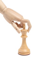 Photo of Robot with chess piece isolated on white. Wooden hand representing artificial intelligence
