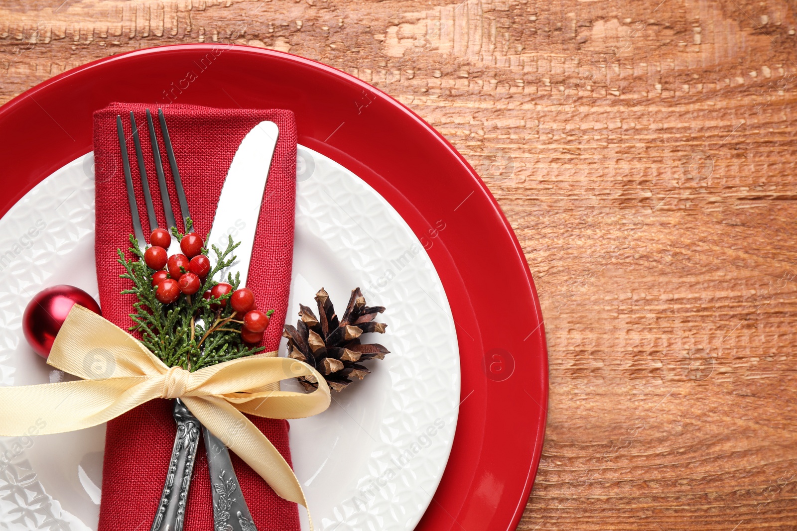 Photo of Beautiful Christmas table setting on wooden background, top view