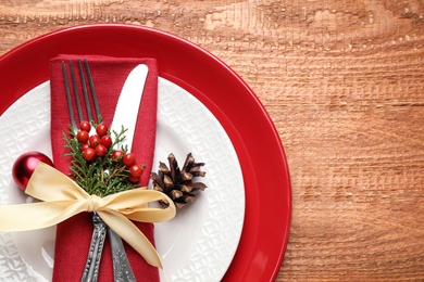 Beautiful Christmas table setting on wooden background, top view