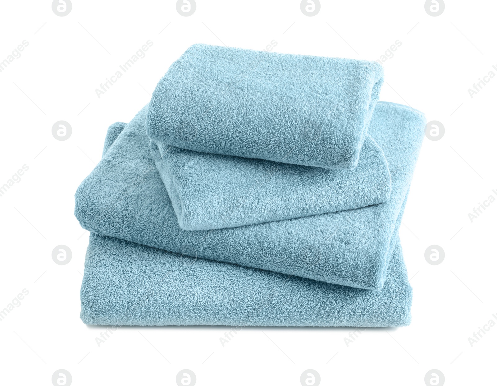 Photo of Stack of clean soft towels on white background