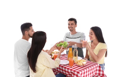 Group of friends at picnic table against white background