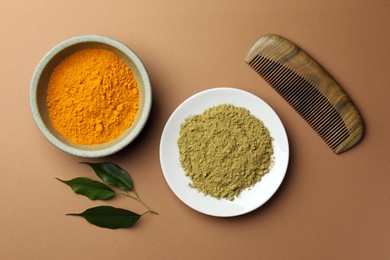 Photo of Flat lay composition with henna and turmeric powder on coral background. Natural hair coloring