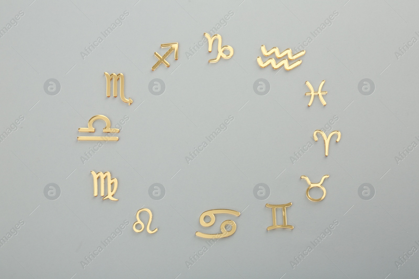 Photo of Zodiac signs on grey background, flat lay. Space for text