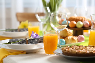 Photo of Festive Easter table setting with traditional meal at home, space for text