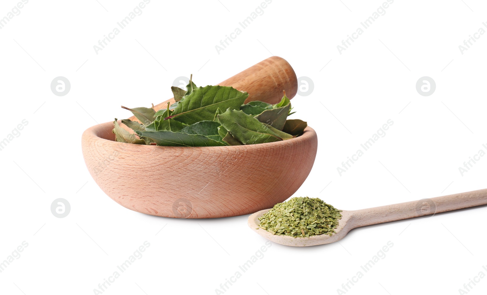 Photo of Wooden mortar and pestle with bay leaves on white background