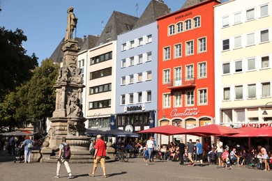 Photo of Cologne, Germany - August 28, 2022: Beautiful residential buildings on city street