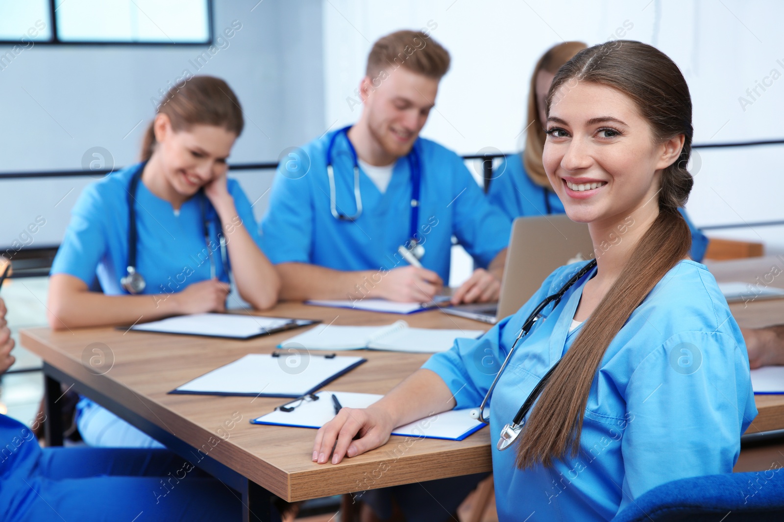 Photo of Medical student with groupmates in university library