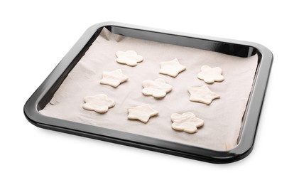 Photo of Baking pan with unbaked cookies and parchment paper isolated on white