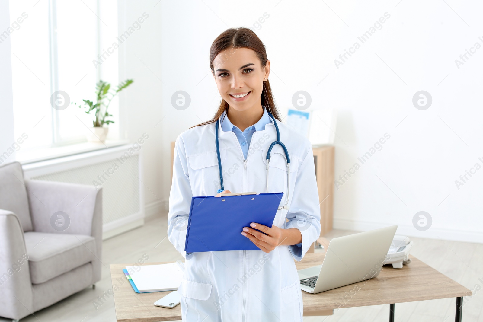 Photo of Female medical assistant working in clinic. Health care service