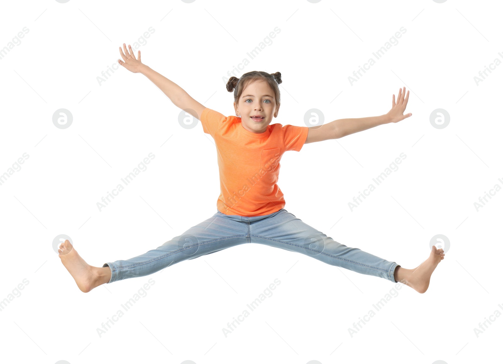 Photo of Cute little girl jumping on white background