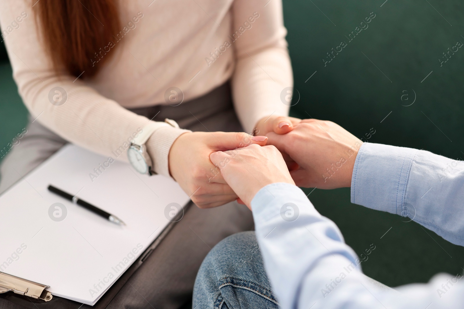 Photo of Psychotherapist working with patient in office, closeup