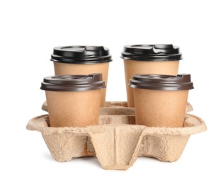 Takeaway paper coffee cups in cardboard holder on white background