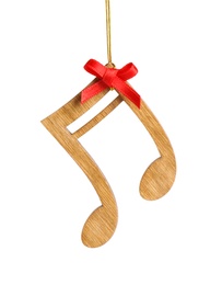 Photo of Wooden note with red bow isolated on white. Christmas music concept