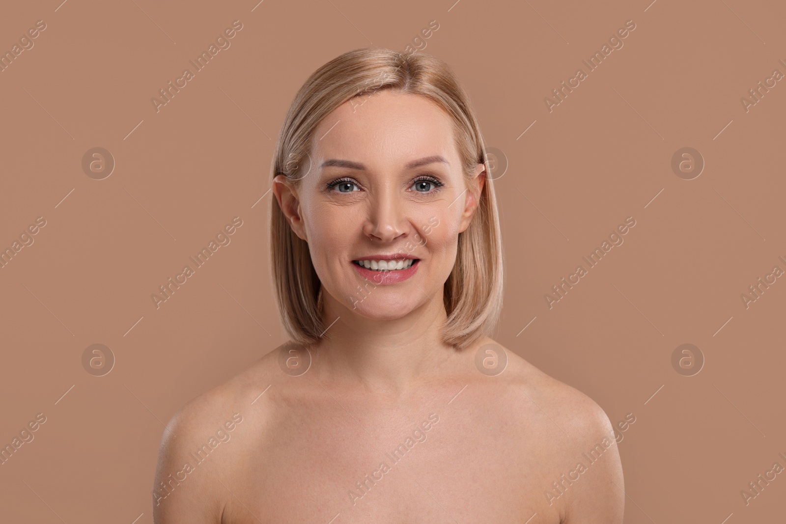 Photo of Beautiful woman with healthy skin on beige background