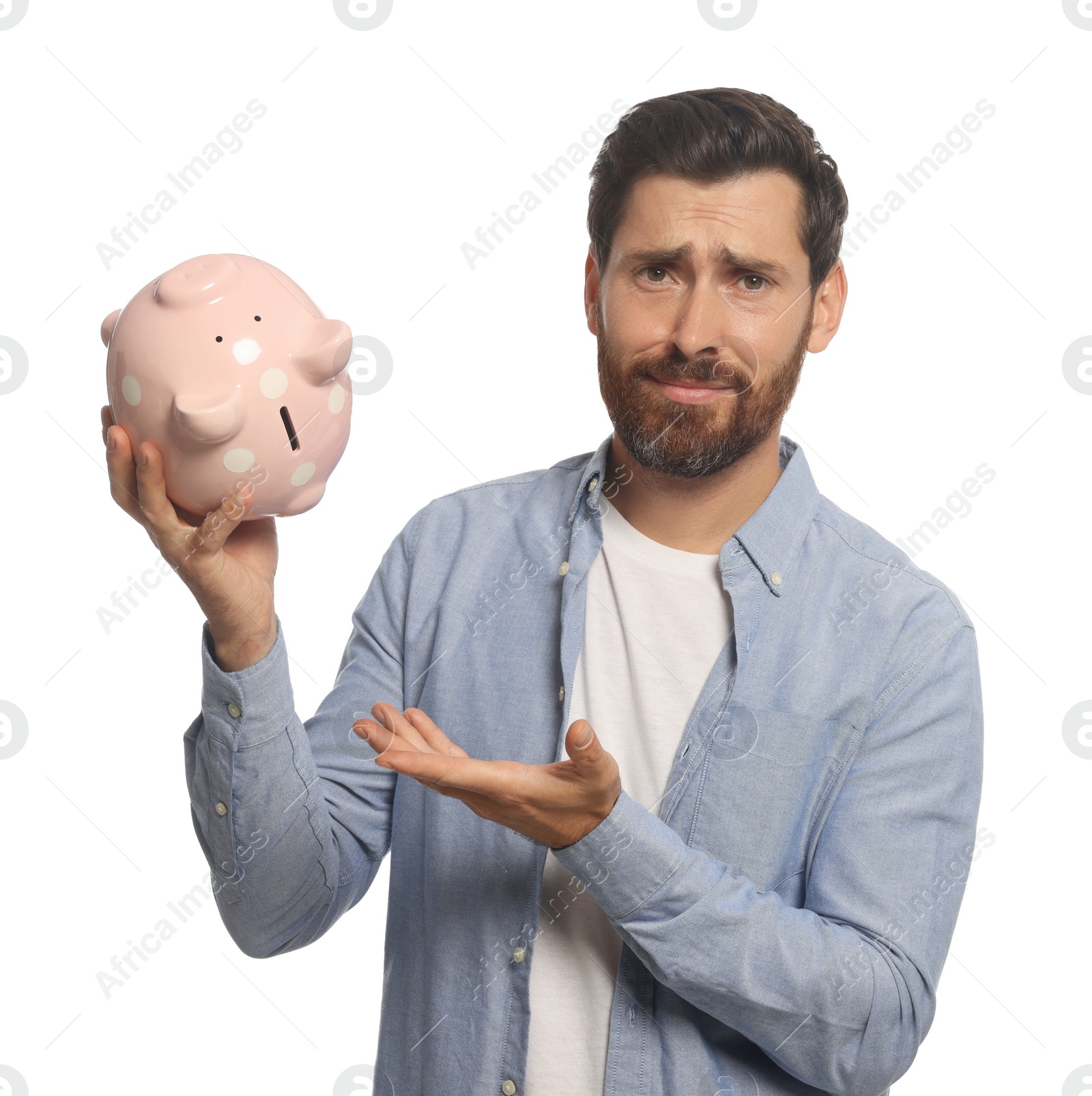 Photo of Man with ceramic piggy bank on white background