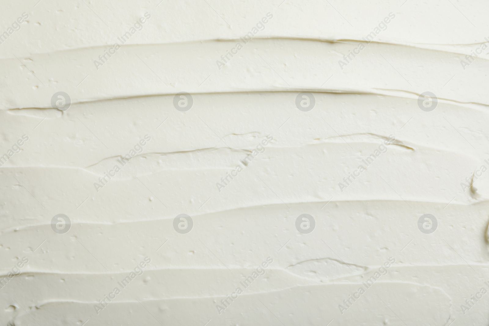 Photo of Closeup of tasty cream cheese as background, top view