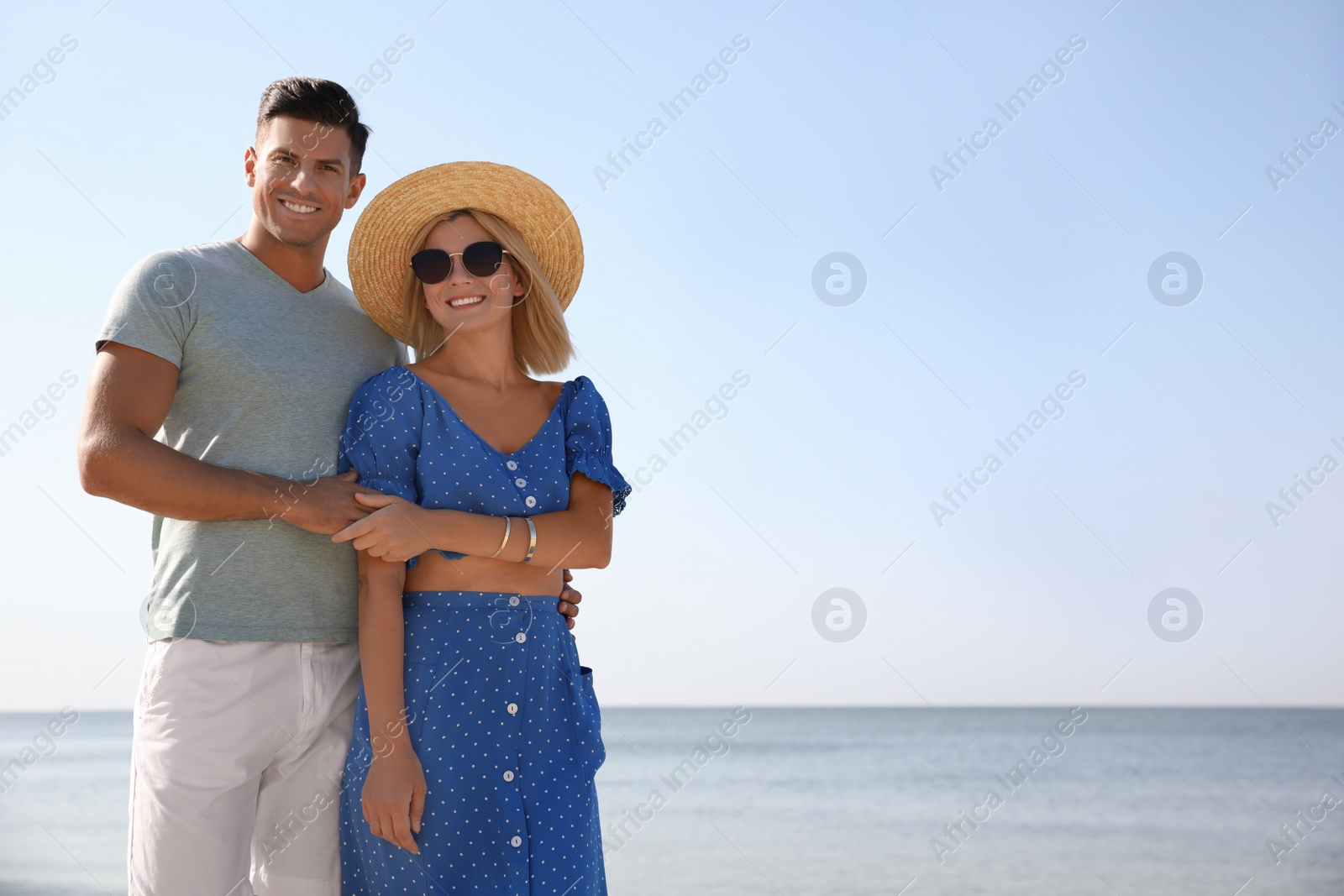 Photo of Happy couple at beach on sunny summer day