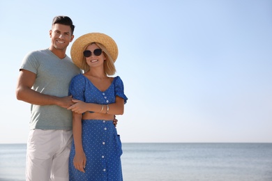 Photo of Happy couple at beach on sunny summer day