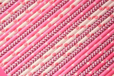 Many paper drinking straws as background, top view