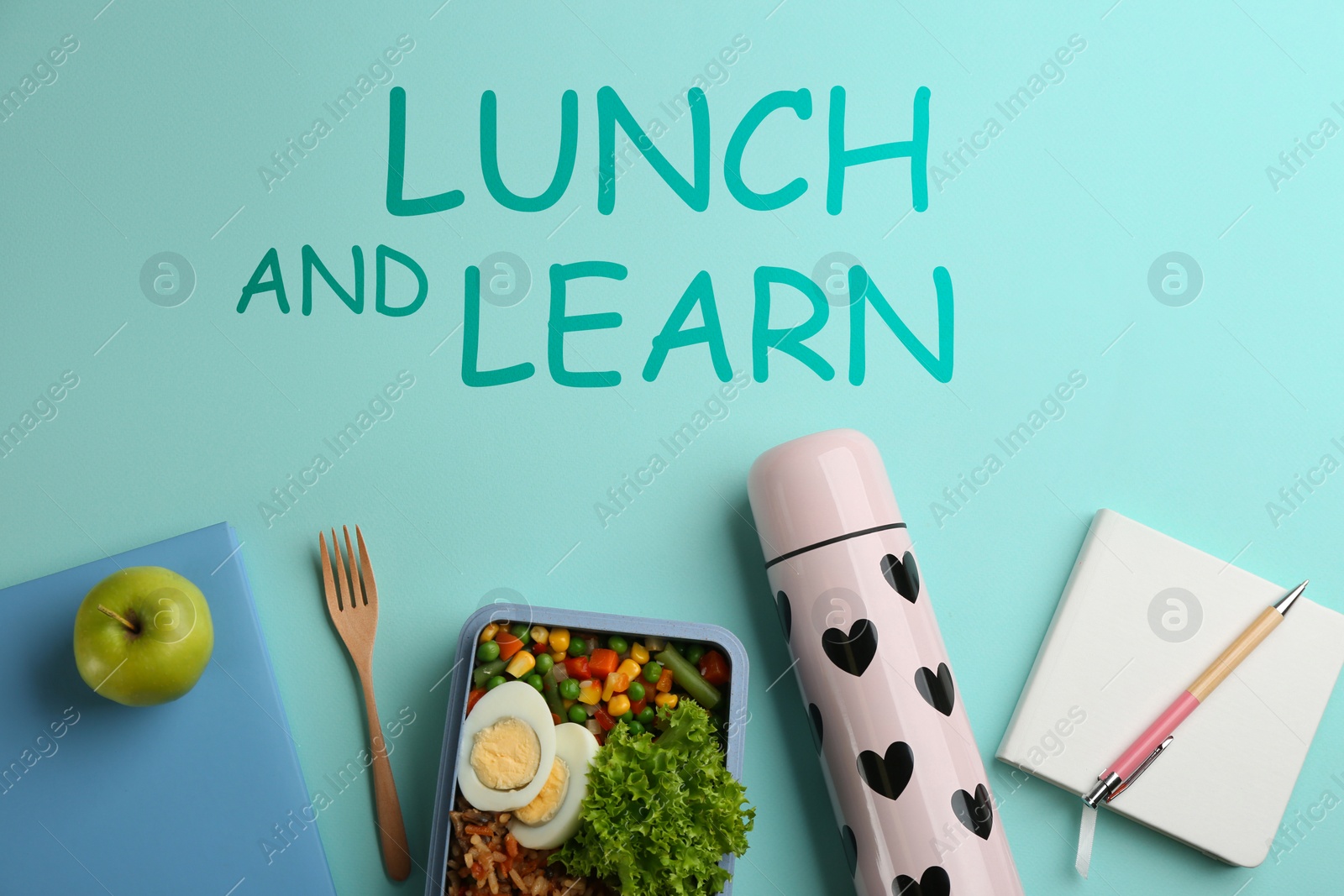 Image of Lunch and Learn concept. Flat lay composition with thermos, food and stationery on light blue background