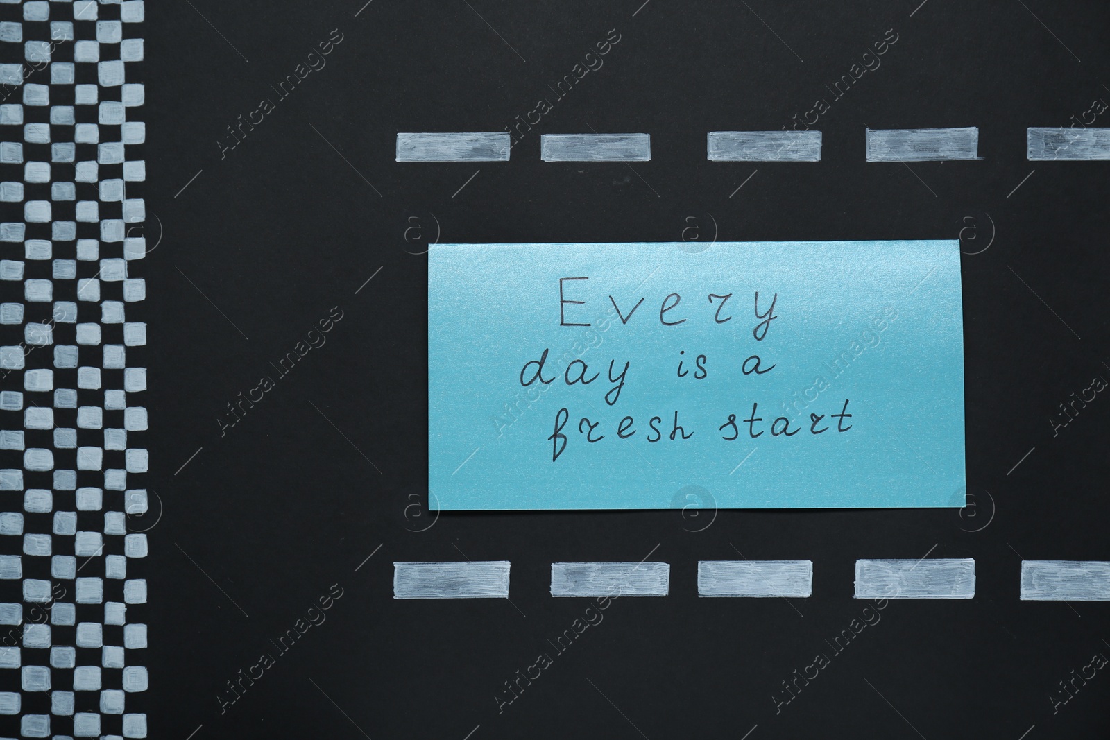 Photo of Card with phrase Every Day Is A Fresh Start on black background, top view. Motivational quote