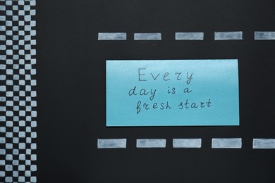 Card with phrase Every Day Is A Fresh Start on black background, top view. Motivational quote