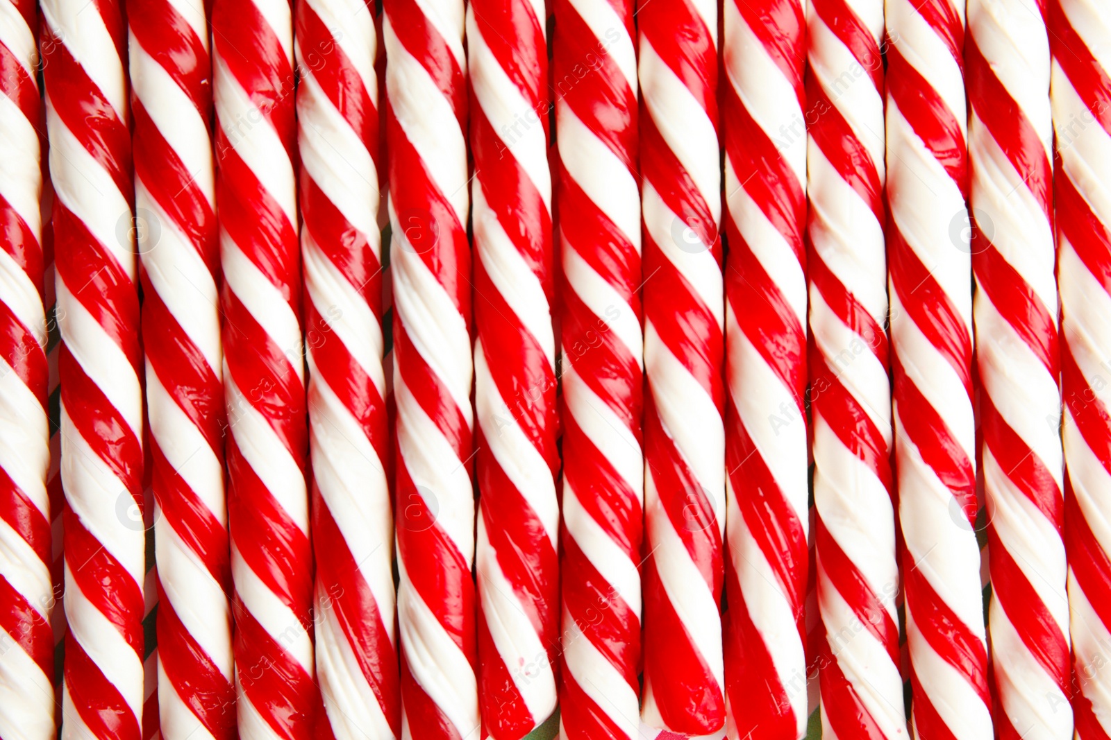 Photo of Many candy canes as background. Festive treat