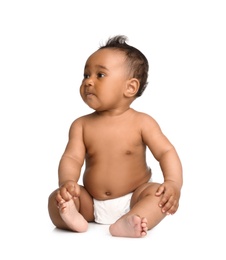 Photo of Adorable African-American baby in diaper on white background