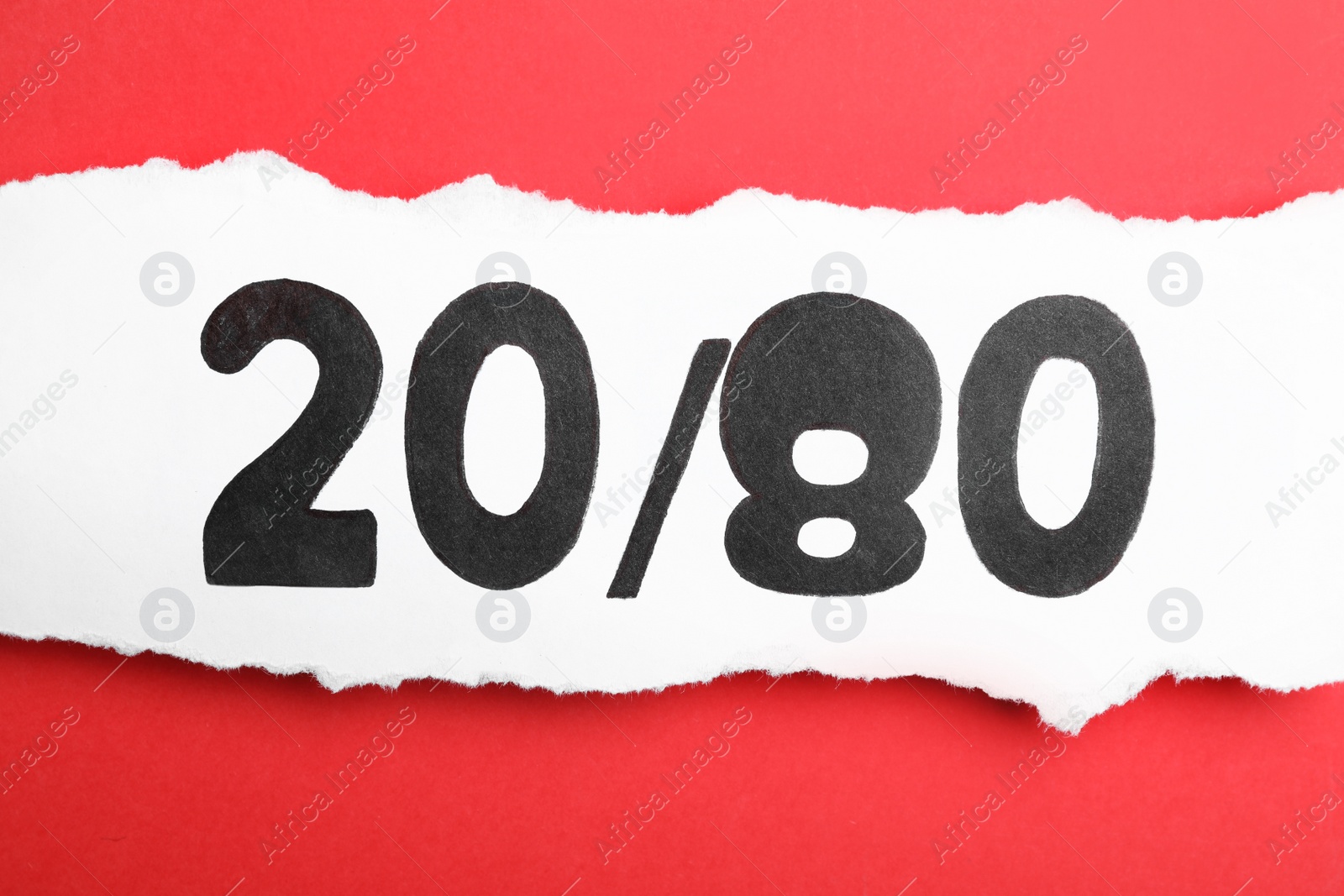 Photo of Sheet of paper with numbers 20 and 80 on red background, top view. Pareto principle concept