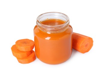 Photo of Tasty baby food in jar and fresh carrot isolated on white
