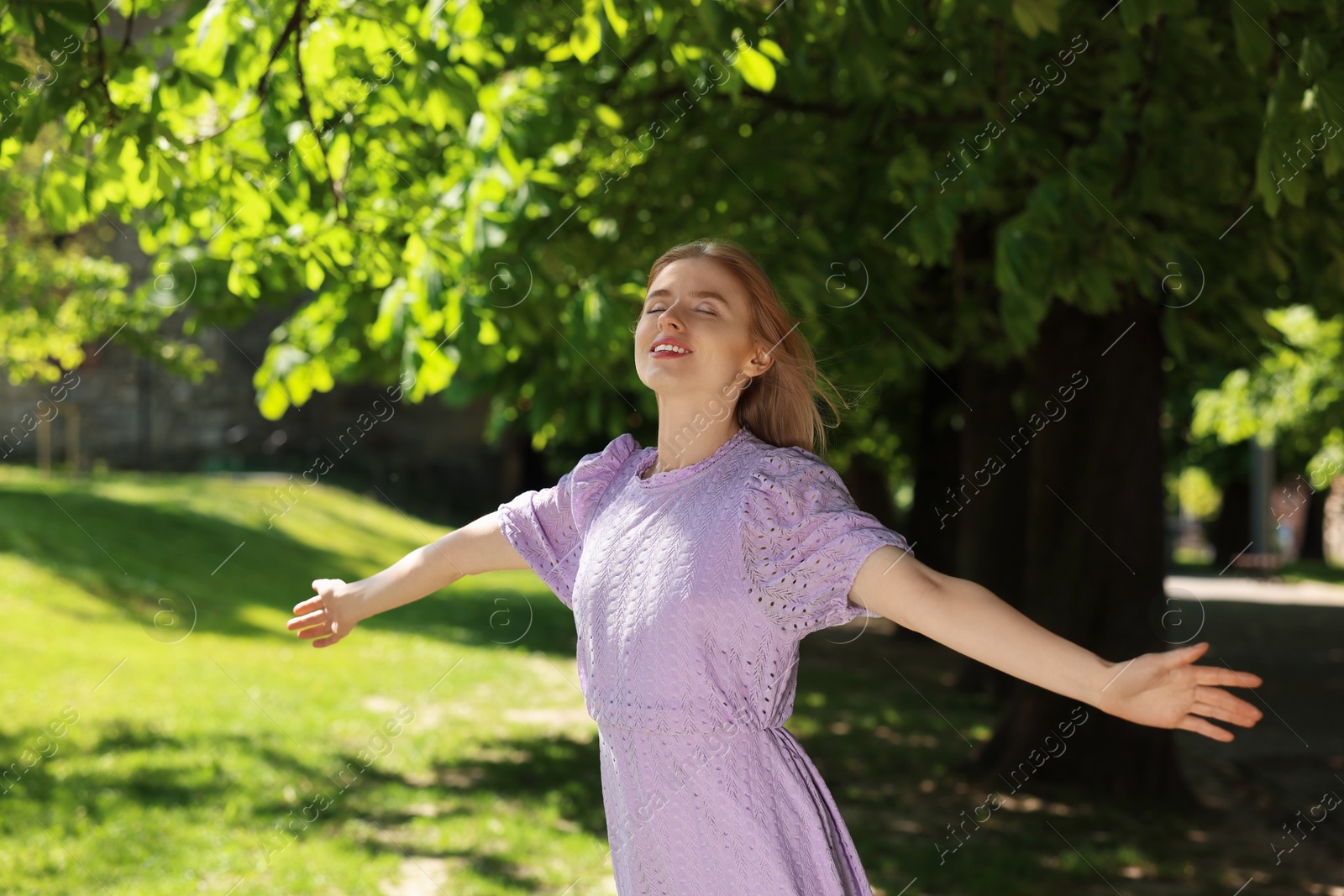 Photo of Beautiful woman in park on spring sunny day