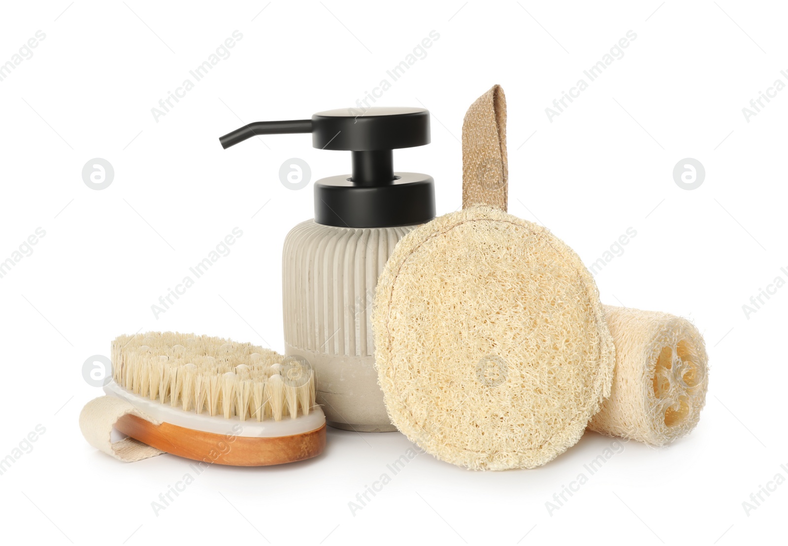 Photo of Set of toiletries with natural loofah sponges on white background