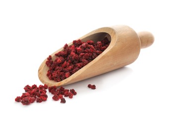 Photo of Dried red currants and wooden scoop on white background