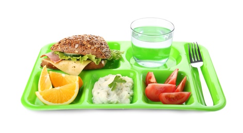 Serving tray with healthy food on white background. School lunch