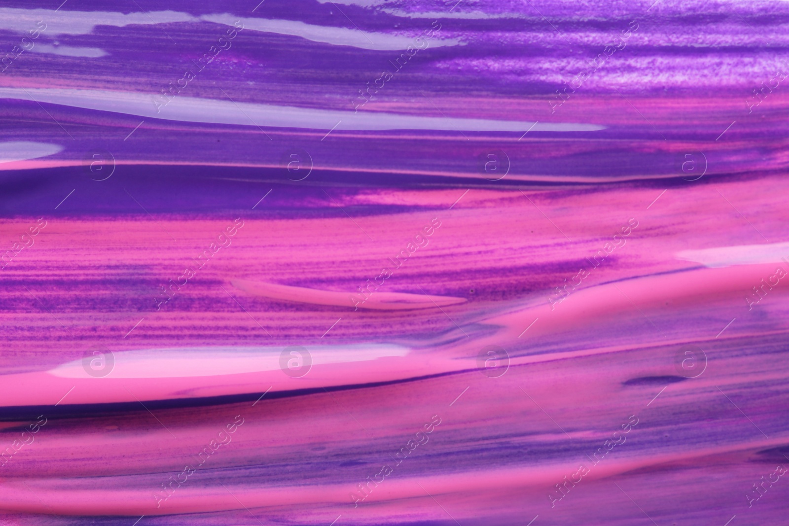 Photo of Abstract brushstrokes of violet paint as background