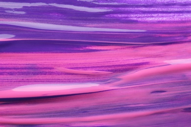 Photo of Abstract brushstrokes of violet paint as background