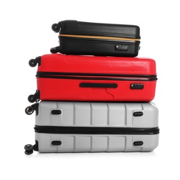 Modern suitcases for travelling on white background