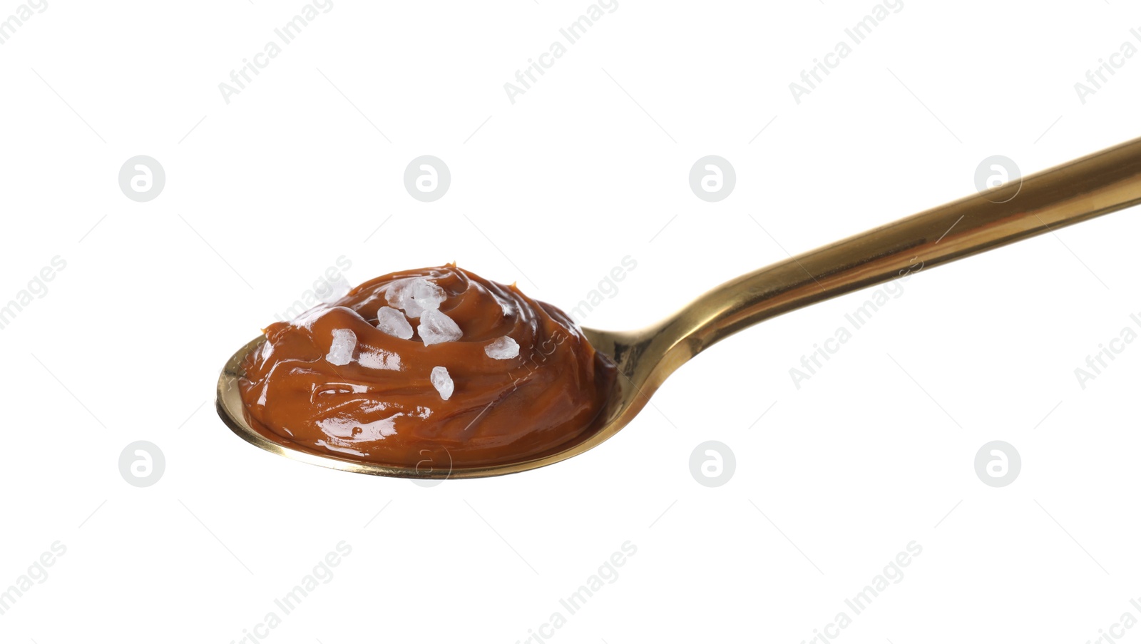 Photo of Salted caramel in spoon isolated on white