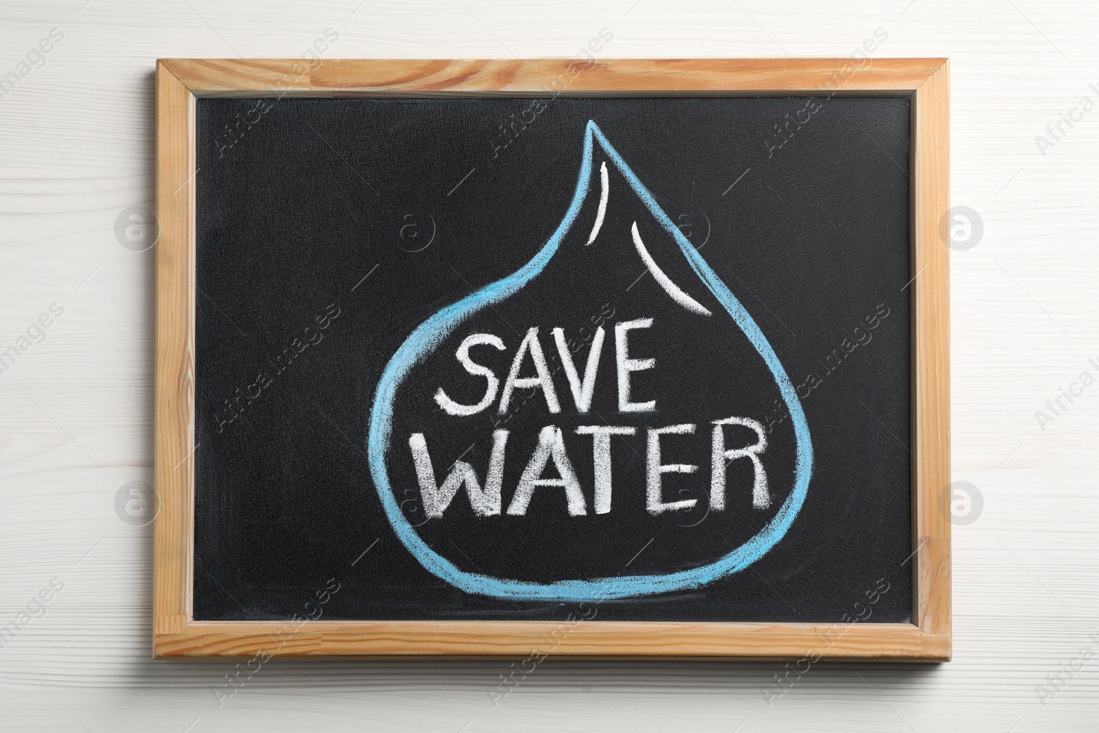 Photo of Blackboard with words Save Water on white wooden table, top view