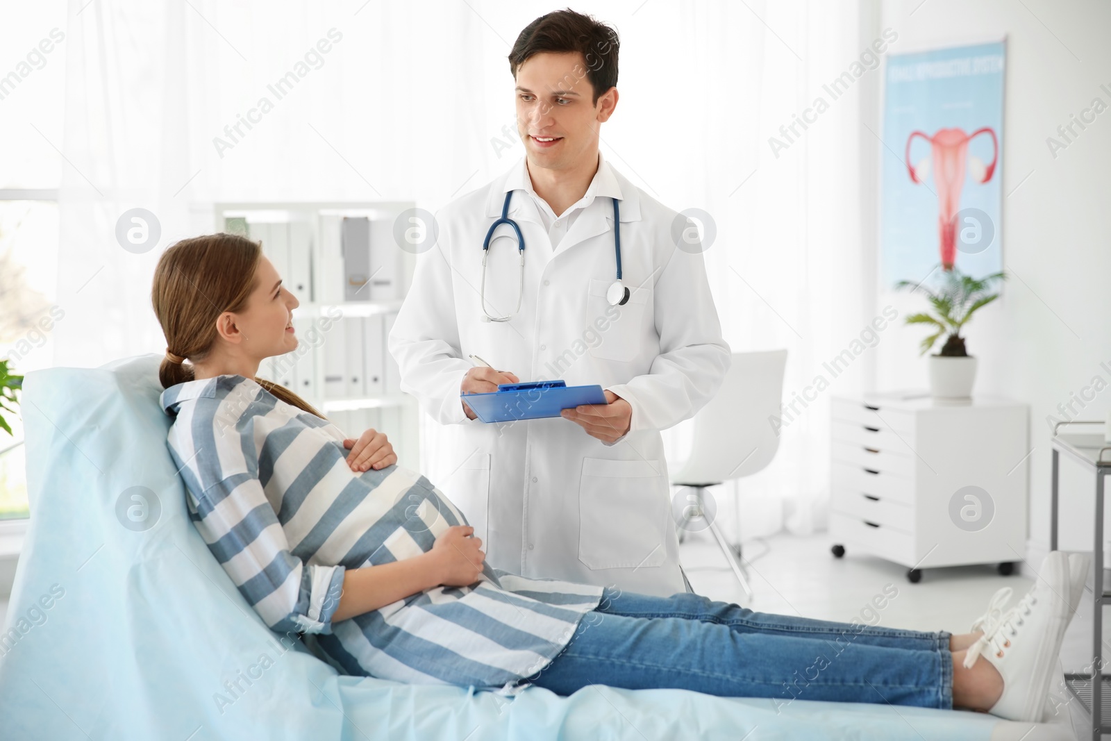 Photo of Gynecology consultation. Pregnant woman with her doctor in clinic