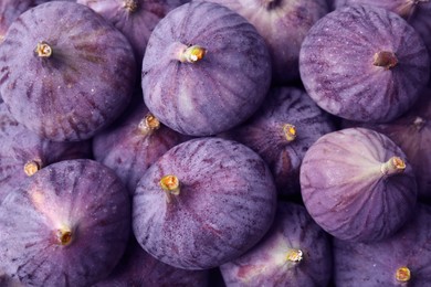 Photo of Closeup of fresh ripe figs as background, top view