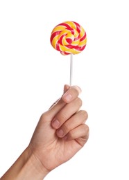 Photo of Woman holding bright tasty lollipop on white background, closeup