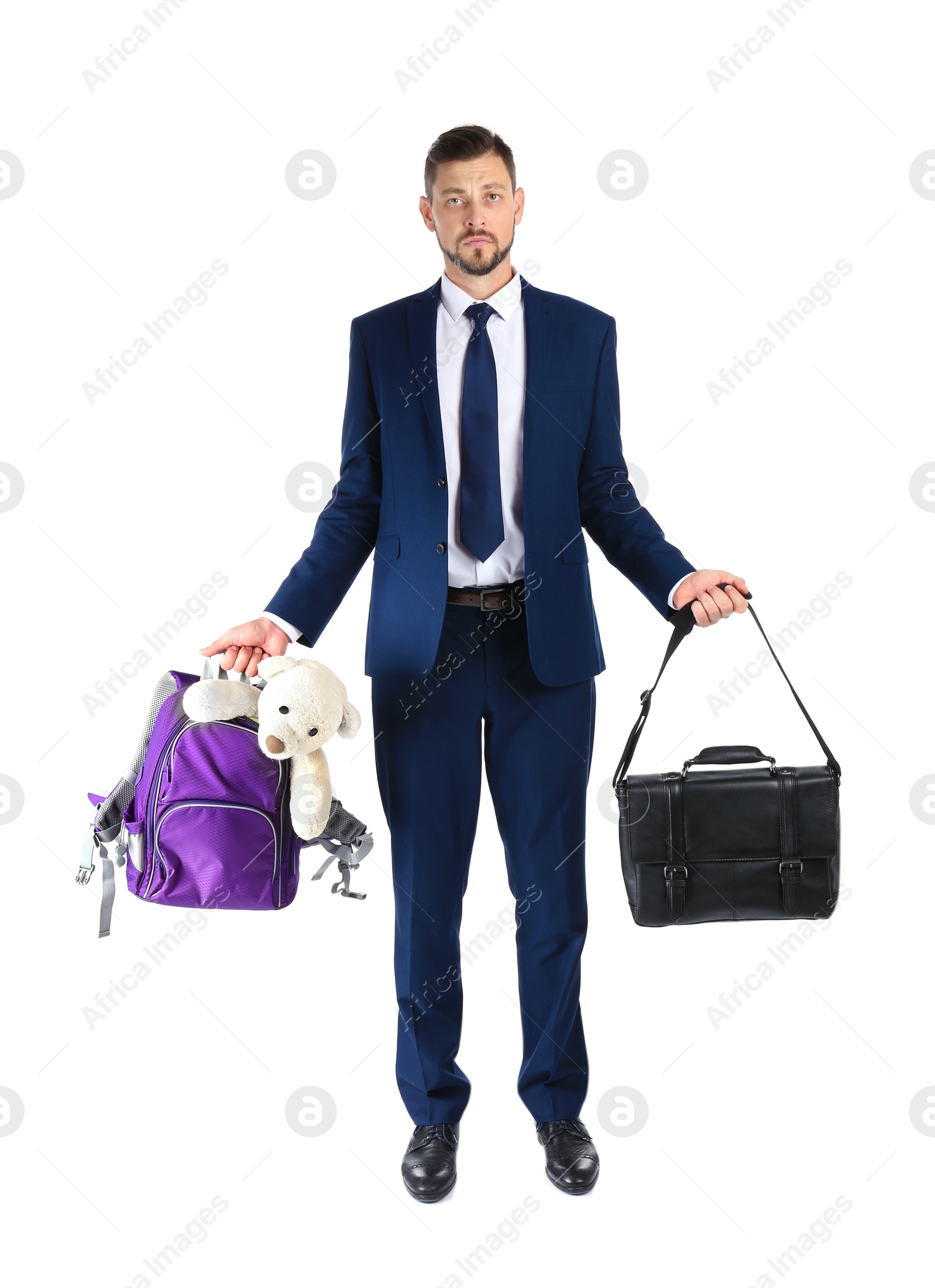 Photo of Businessman holding briefcase and backpack with toy on white background. Combining life and work